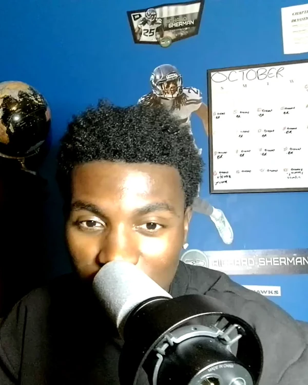 Justin Jordan at his podcast microphone